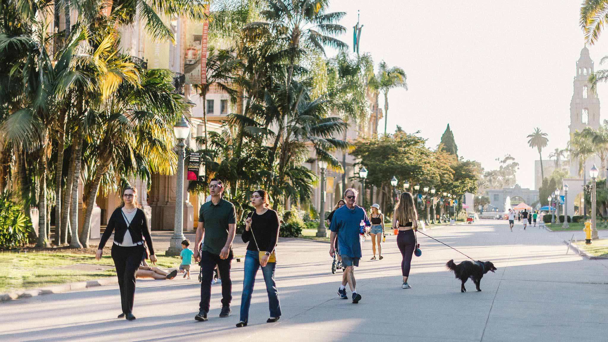 People walking through Balboa Park on a sunny day